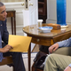 President Obama explains COBRA options to a departing American.
